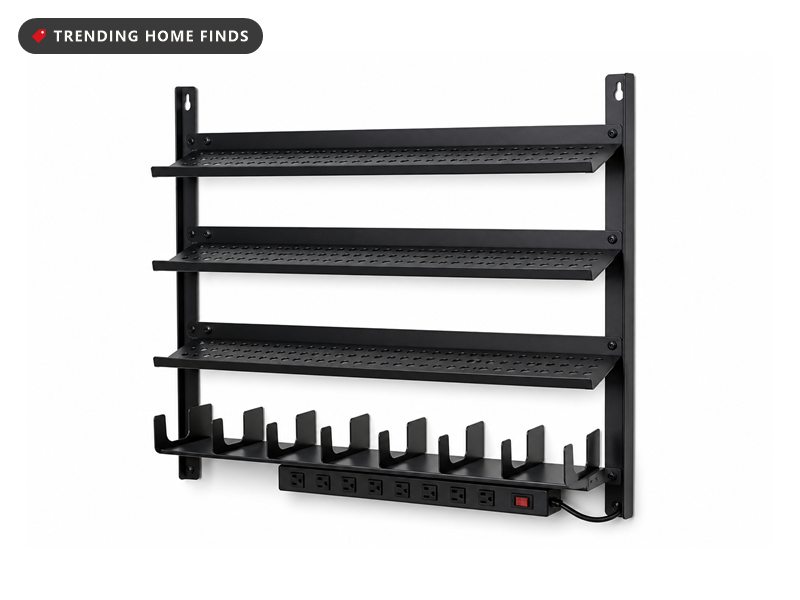 Tall black steel wall rack with four tiers, a row of eight open drill cradles along the bottom and a power strip beneath them.