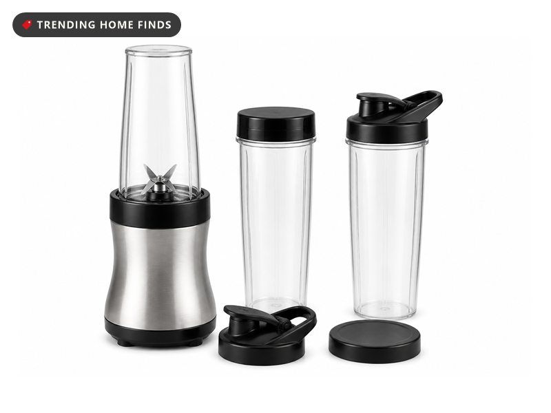Ninja personal blender base with a blending cup attached and two extra 20 oz cups with lids