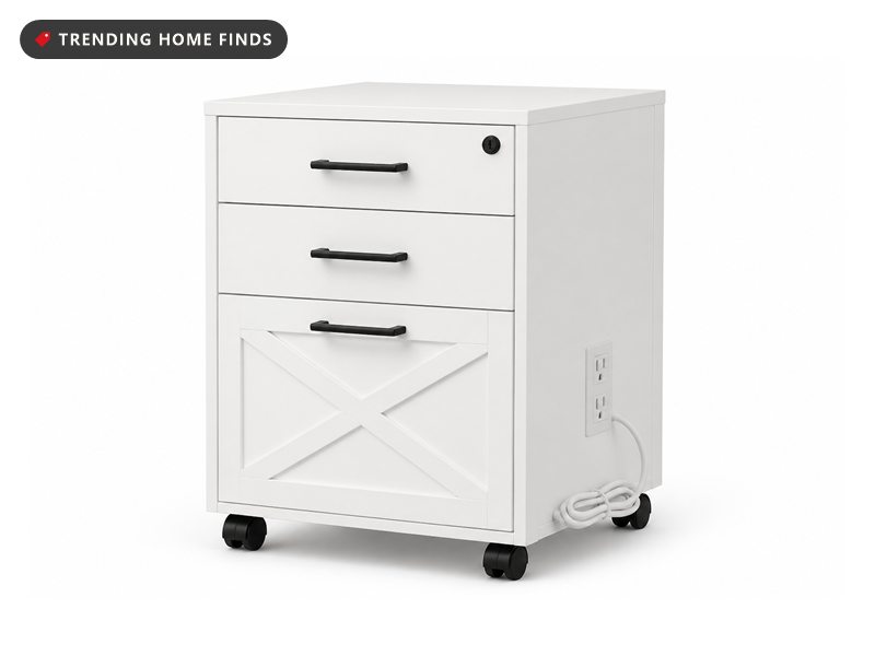 White three drawer rolling cabinet with black bar pulls, a cross panel on the deep bottom drawer and four casters.