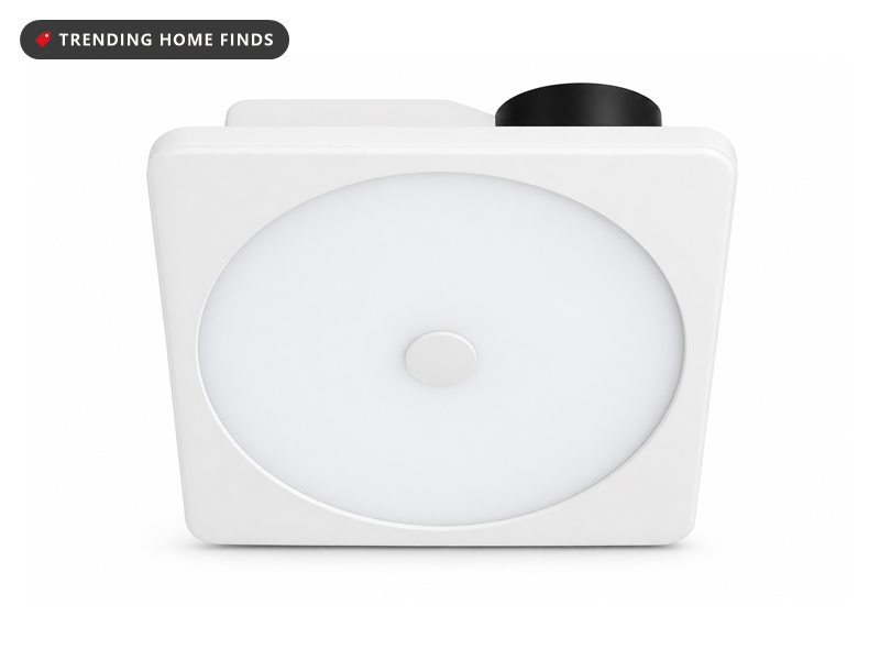 Square bathroom ceiling fan with a smooth white frame, a large circular frosted diffuser and a small round sensor at its centre.