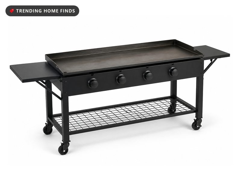 A black flat-top griddle on a backyard patio at golden hour, smash burger patties searing on the steel with a spatula lifting one mid-flip.
