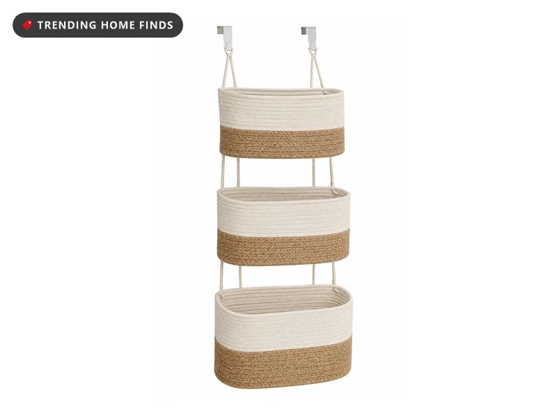Three-tier hanging storage baskets in woven cream cotton and jute, suspended vertically from a rope hanger