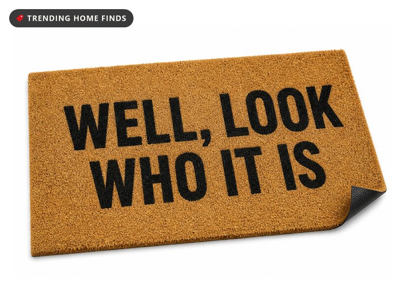 Natural coir welcome mat with a humorous saying and rubber backing, on a white background