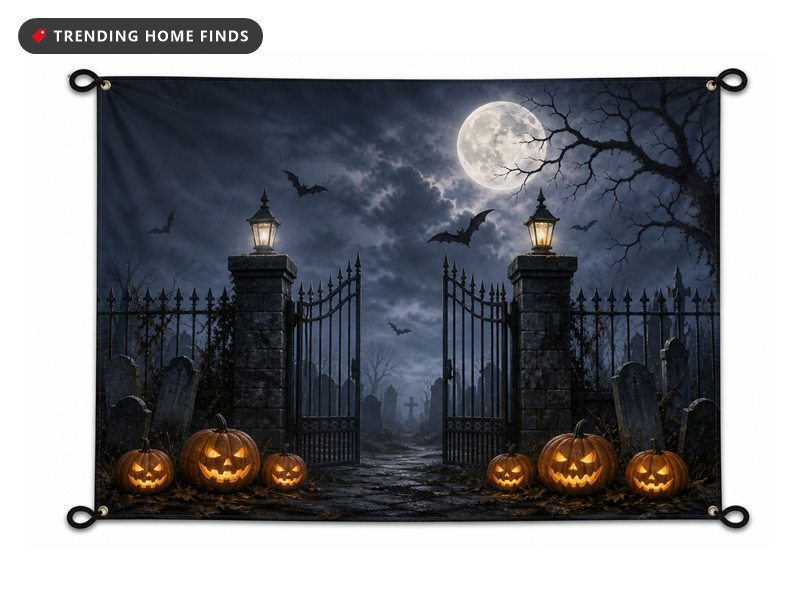 Large printed Halloween banner showing a moonlit graveyard with an open iron gate, bats, headstones and lit pumpkins.