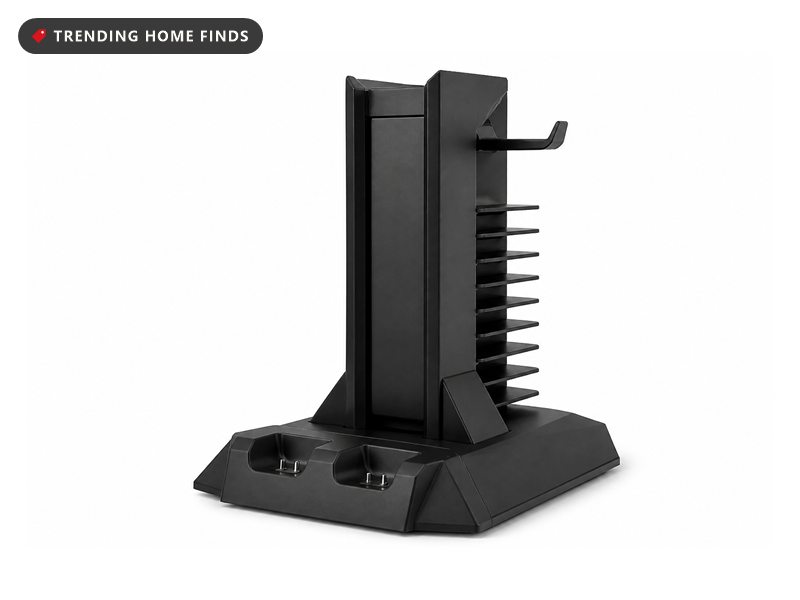 Black vertical console cooling stand with a controller charging dock and disc slots, on white.