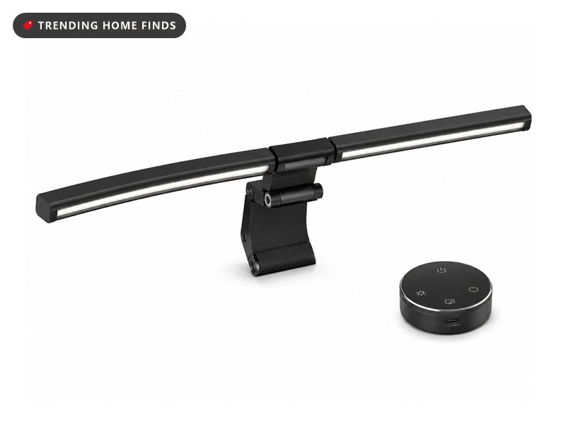 Curved black light bar that clips over a monitor, shown with a separate round control dial