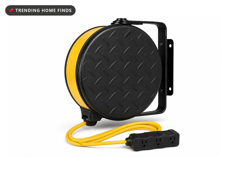 A matte black steel cord reel with a safety yellow rim on a swivel mounting bracket, with a yellow cord and a three outlet tap.