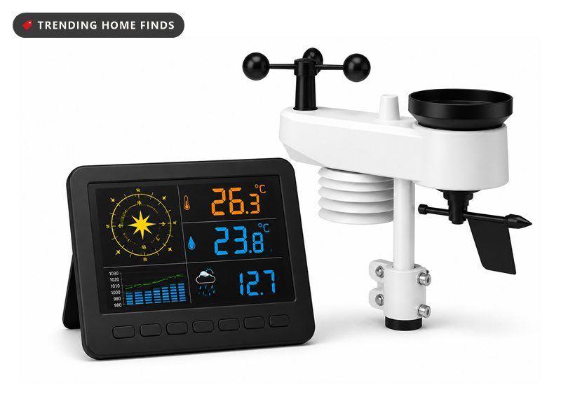 Black weather station display showing a wind rose and temperatures beside a white outdoor sensor with an anemometer and rain funnel.