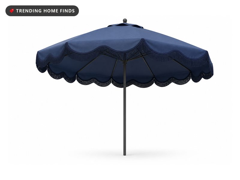 Dusk blue nine foot patio umbrella open, with a navy scalloped edge and short fringe on six ribs.