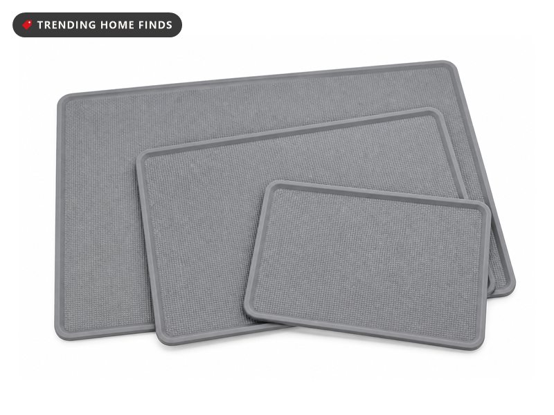 Three matte grey silicone baking mats in two half-sheet and one quarter-sheet size, fanned on a white background.