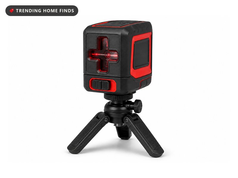 Red and black SKIL laser level projecting a 360 degree red line, with its tripod and soft carry case beside it.