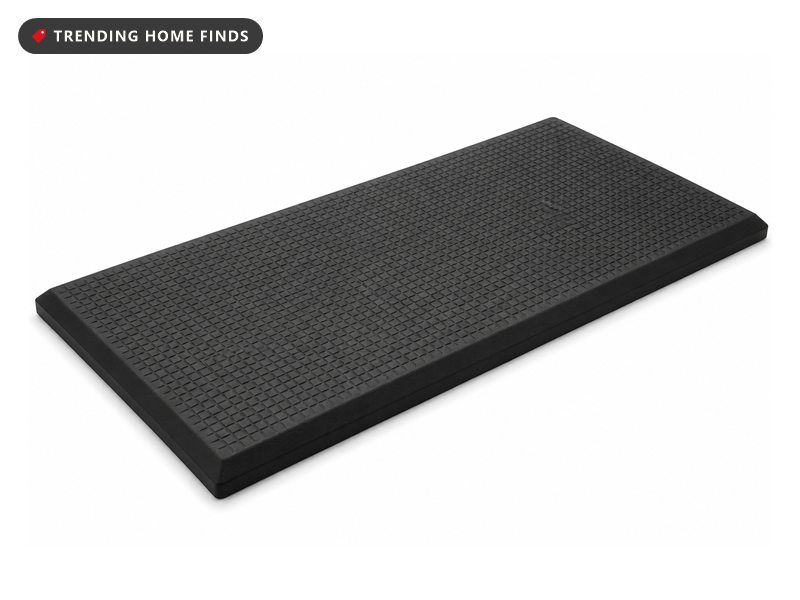 A rectangular black cushioned floor mat with a raised diamond texture and bevelled edges all round.