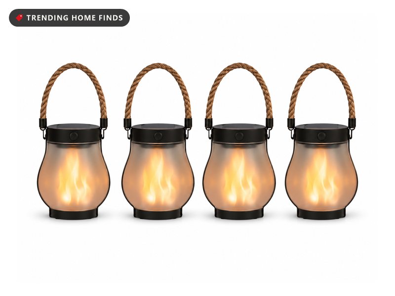 Four black solar lanterns with rope handles and a warm flickering flame glow behind frosted glass