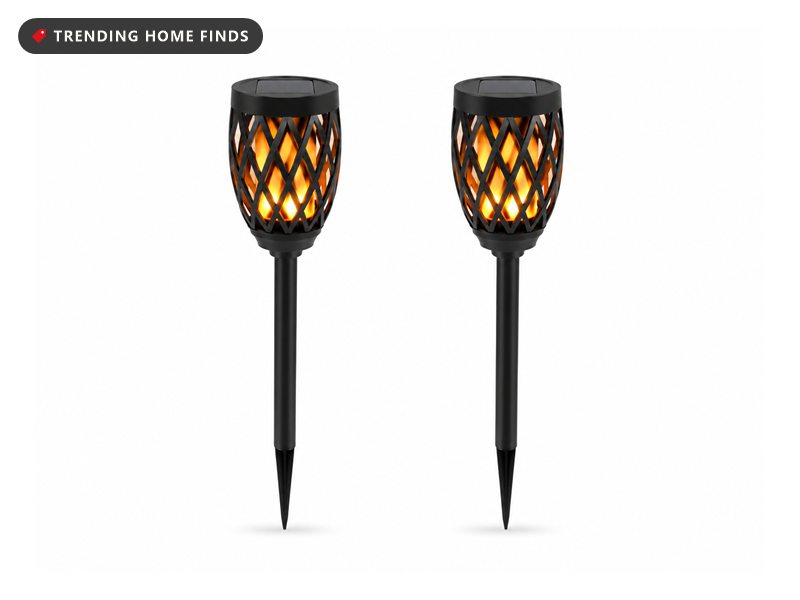 Two black solar pathway torch lights with a flickering flame effect