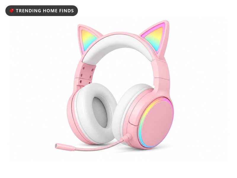 Pink over-ear gaming headset with cat ears lit in rainbow colours, a rainbow ring around the earcup, soft white ear pads and a slim boom microphone swung down