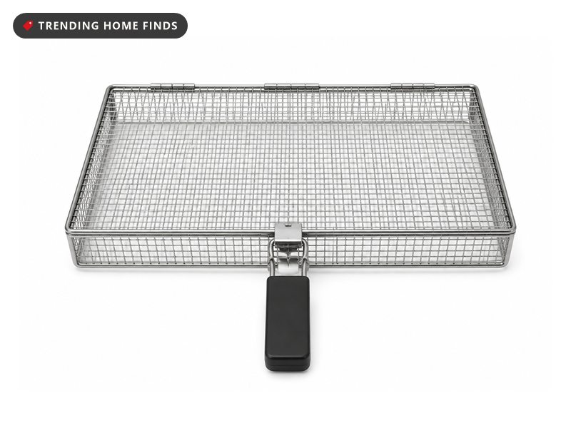 A rectangular stainless steel mesh grill basket with a hinged lid and a black handle.