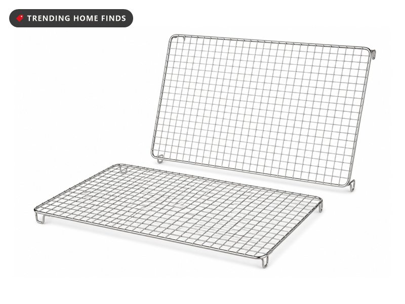 Two bright steel wire cooling racks in a close square mesh, standing on small integrated corner feet.