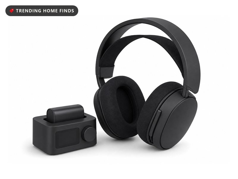 Black wireless gaming headset with its charging base station, on a white background