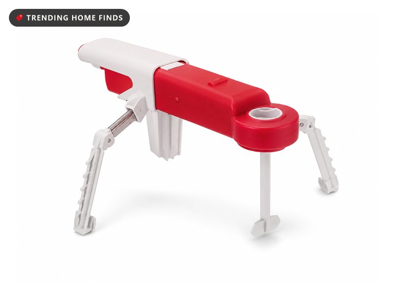 Red and white StirMATE automatic pot stirrer standing on three adjustable legs