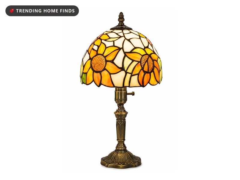 Tiffany style stained glass table lamp with a sunflower pattern on a bronze base