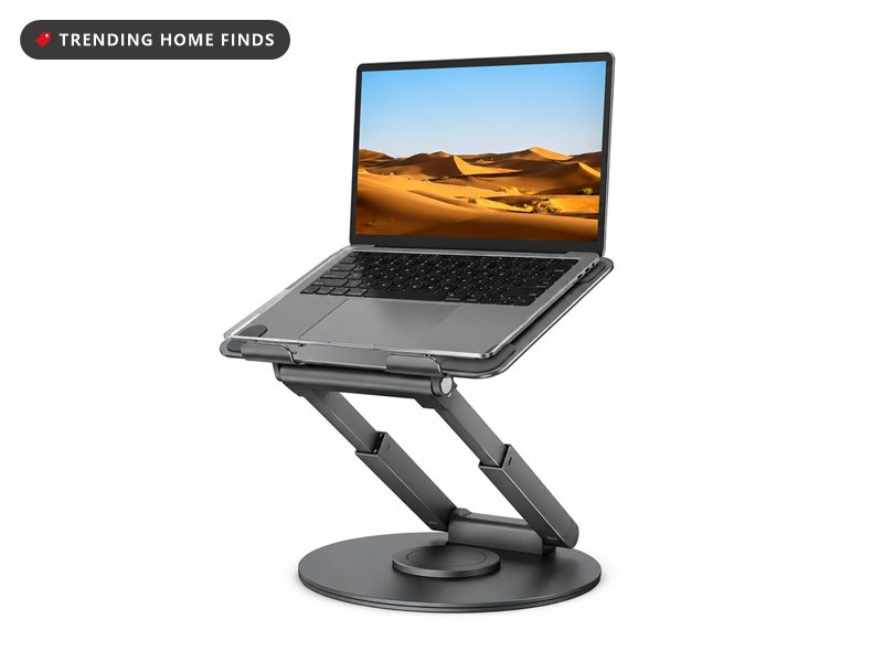 Silver telescopic laptop stand holding an open laptop above a round swivel base