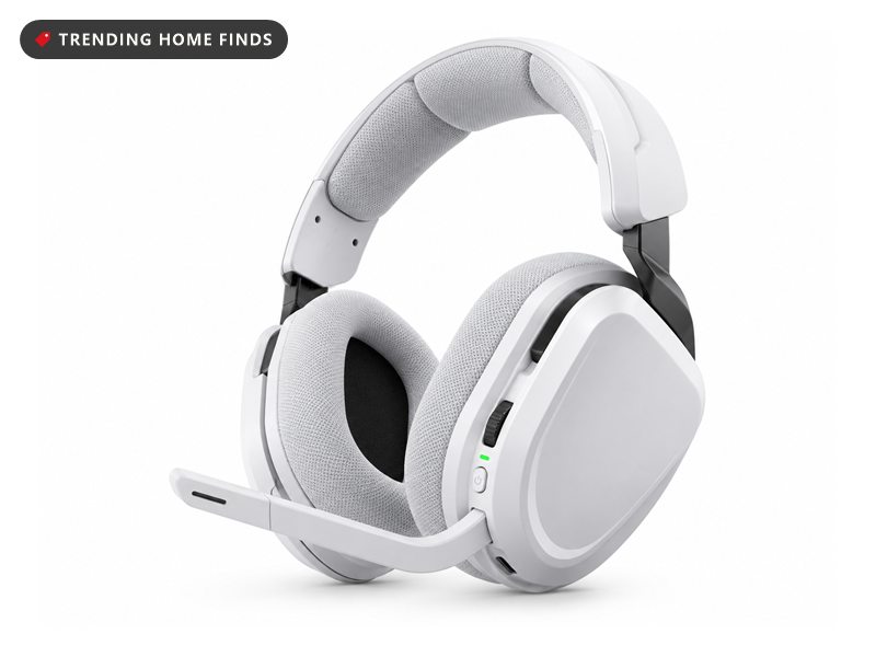 White wireless gaming headset with grey fabric ear cushions and headband, a volume wheel and power button on the earcup and a short flip down boom microphone