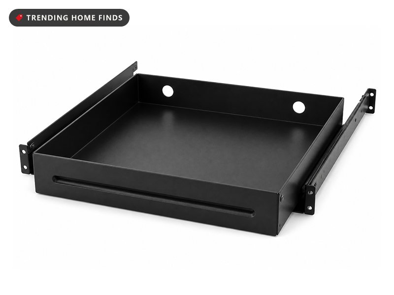 A matte black carbon steel undermount drawer with a long pressed finger pull and side mounting rails.