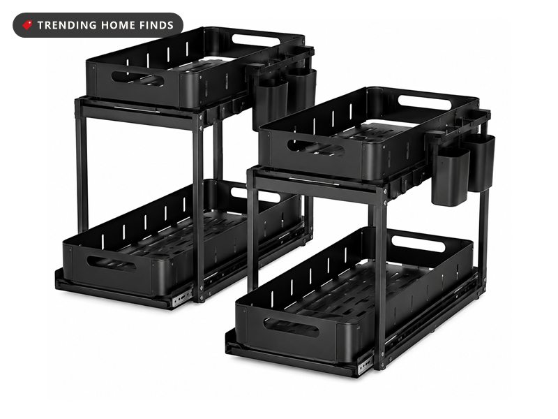 Two black two-tier under-sink organizers with sliding metal drawers and side hooks