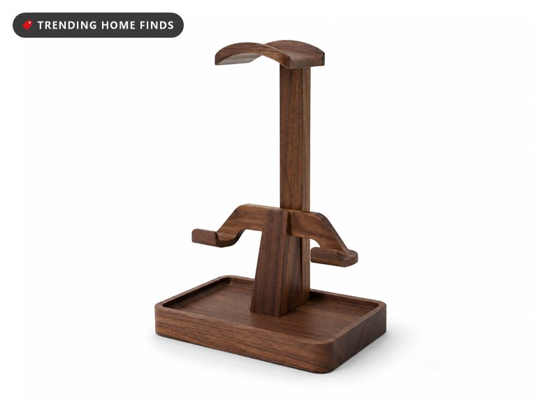 Walnut toned wooden headphone stand with a controller hook partway down the stem and a rectangular storage tray base