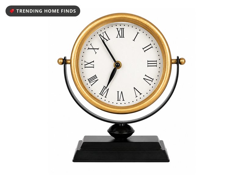 Vintage style table clock with a gold frame, roman numerals and black base
