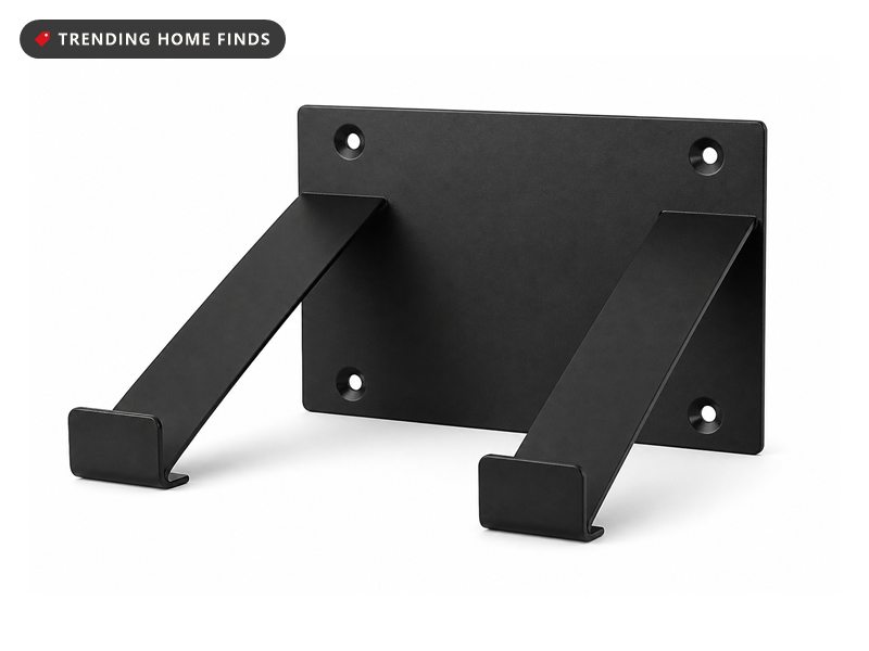 Open frame black steel wall bracket with a flat back plate, four screw holes and two wide arms bent forward to cradle a console.
