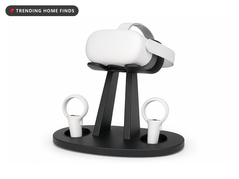 A matte black VR stand holding a white headset and two controllers.