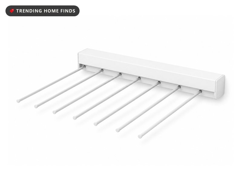 White wall mounted retractable drying rack shown folded flat and extended, six rods holding towels and shirts.