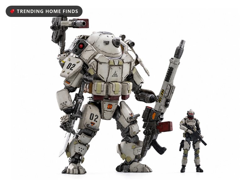 White sci fi mech action figure in weathered armor with a red visor and shoulder cannon, standing beside a small soldier figure in matching armor