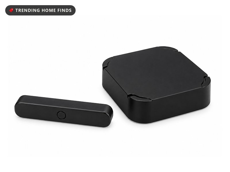 Slim black rectangular mailbox sensor bar beside a rounded square black base station.