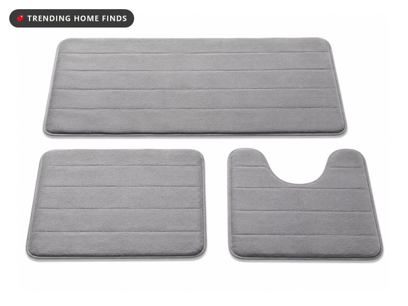 Three piece gray memory foam bath mat set: a long runner, a rectangular mat and a U-shaped toilet rug, all with stitched stripe lines